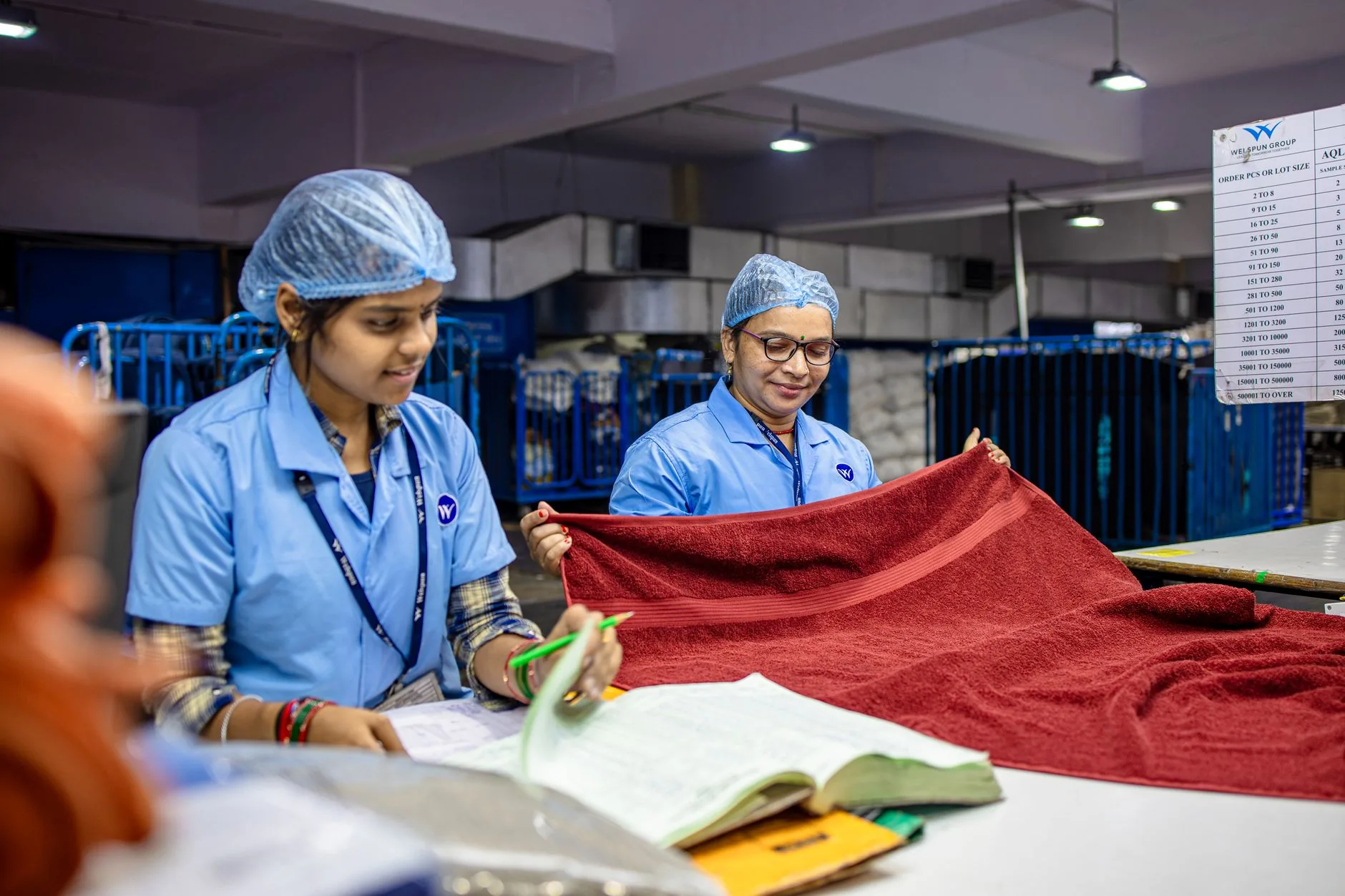 Workers sewing garments in an ethical Bangladesh apparel factory, global sourcing, fair labor practices.